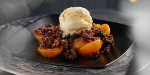 Baked fruit with Christmas pudding crumble
